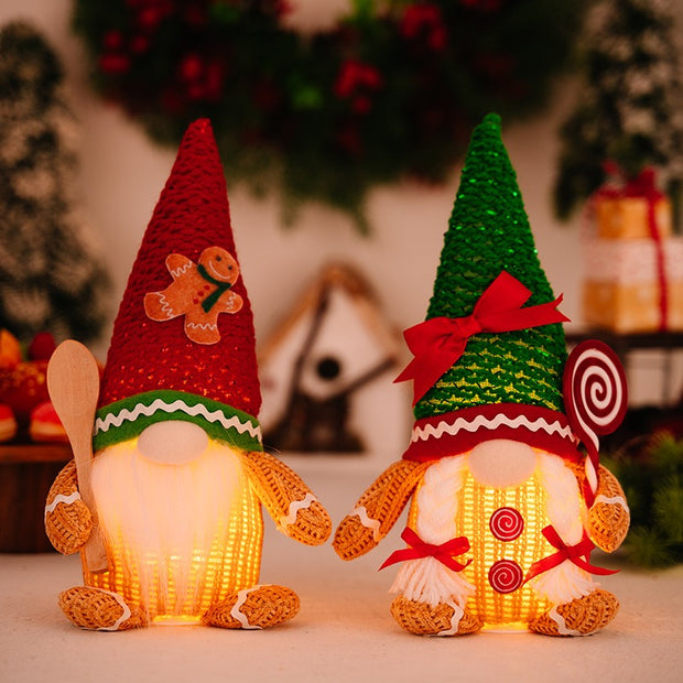 Christmas decoration gingerbread figurine glowing biscuit figurine red green pointed hat with light figurine