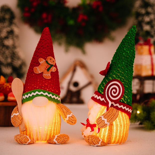 Christmas decoration gingerbread figurine glowing biscuit figurine red green pointed hat with light figurine